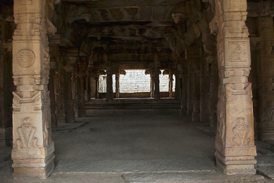 Carved pillars of the Kalyana Mandapa, Divine Marriage Hall, Achyuta Raya temple, Hampi, Karnataka. Sacred Center. Interior view from the east.