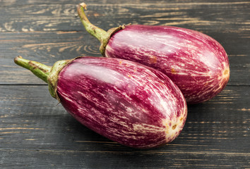 Two purple eggplants