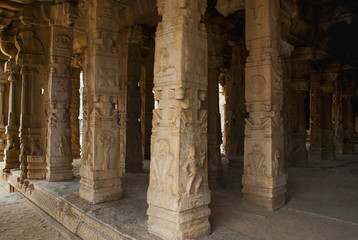 Fototapeta premium Carved pillars of the Kalyana Mandapa, Divine Marriage Hall, Achyuta Raya temple, Hampi, Karnataka. Sacred Center. Interior view from the north-east.