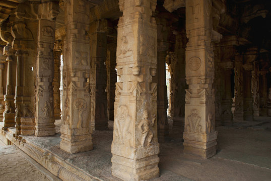 Carved pillars of the Kalyana Mandapa, Divine Marriage Hall, Achyuta Raya temple, Hampi, Karnataka. Sacred Center. Interior view from the north-east.
