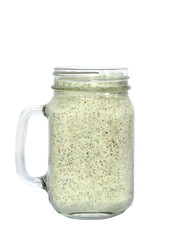 Energy smoothie in a mason jar with white background.