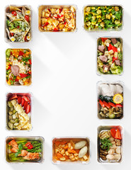 Frame made of healthy food boxes on white background