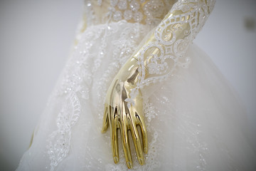 Gold mannequin in wedding dress