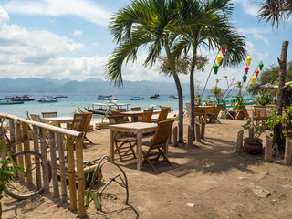 Beach rest pavillion in Gili islands, Trawangan, Indonesia. Blue sand and blue sky and water. Indonesia, 2017