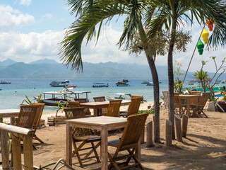 Beach rest pavillion in Gili islands, Trawangan, Indonesia. Blue sand and blue sky and water. Indonesia, 2017