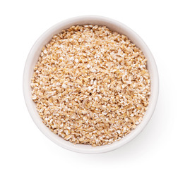 Barley grits in bowl isolated on white