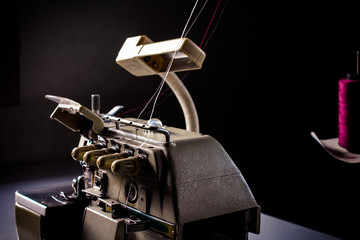 Old retro classic sewing machine on wood.vintage tone