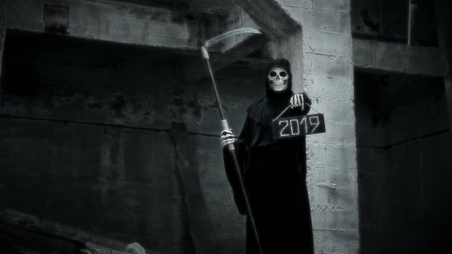death with a scythe raises a sign with the inscription 2019