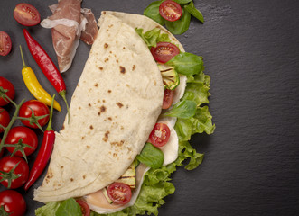 Piadina romagnola with cheese and ham