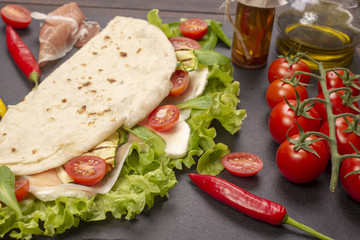 Piadina romagnola with cheese and ham