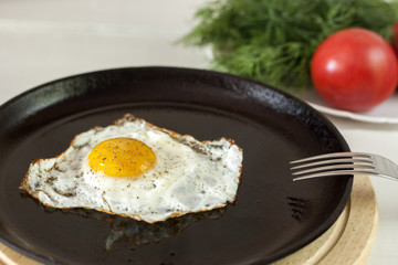 Fried egg on frying pan