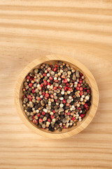 An overhead photo of a mix of various peppers with copy space