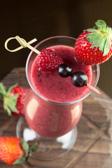 Strawberry smoothie on dark background