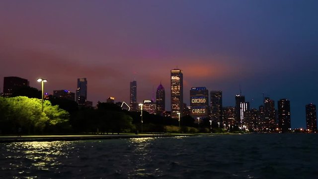 The Chicago, Illinois skyline at night after a storm across Lake Michigan.