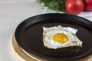 Fried egg on frying pan