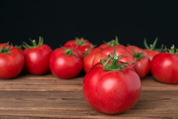 tomatoes on wooden background