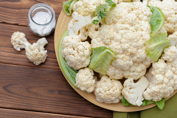 Organic cauliflower on wooden background