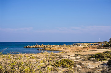 Fototapeta na wymiar Picturesque seashore with rocks and sand