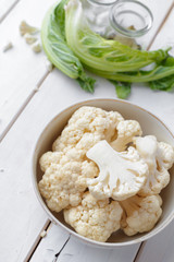 Organic cauliflower on wooden background