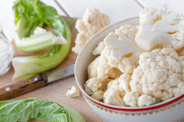Organic cauliflower on wooden background