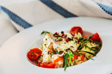 Andalusian fish, saffron rice with vegetables