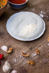Gomi (mamaliga porridge) - popular dish from Samegrelo region made of white coarse cornmeal, butter and salt. Georgian traditional food.
