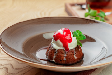 Chocolate fondant with ice cream top close up