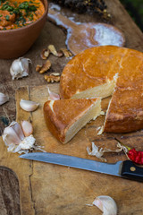 Suluguni cheese piece. Pickled or brined traditional Georgian smocked cheese from the Samegrelo region made of cow milk. Popular diary product in Georgia
