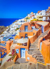 Oia, Santorini island, Greece: Classical view over in Oia with traditional and famous houses and churches over the Caldera, Aegean sea. - obrazy, fototapety, plakaty