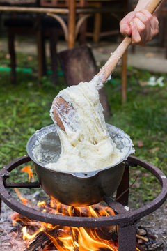 Elarji - from Samegrelo region, made from coarse cornmeal, cornflour and Suluguni cheese. Gomi cooked with cheese. Georgian traditional food - elardji. 