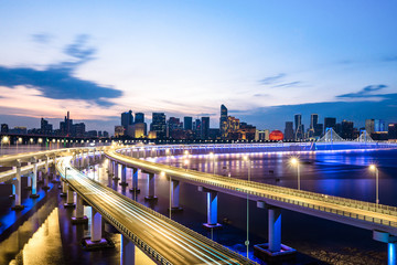 empty asphalt road with city skyline