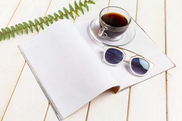 Mock-up magazine or catalog on a wooden table.