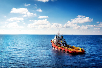 Supply boat or crew boat transfer cargo to oil and gas industry and moving cargo from the boat to...