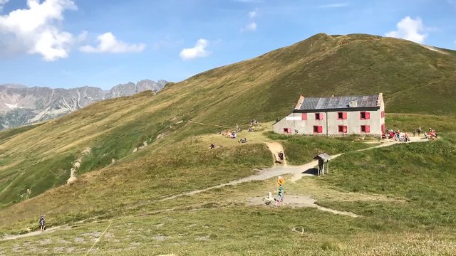 Mountain refuge and hiker