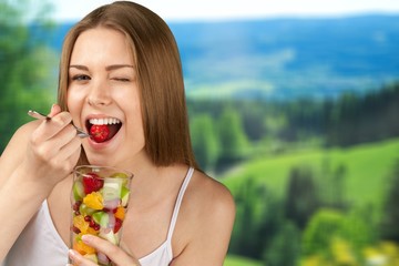 Attractive caucasian woman with fruit salad