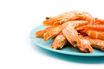 Grilled shrimps on blue plate isolated on white background     © chandlervid85