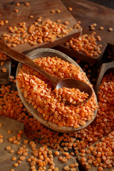 Red lentils in a bowl with a spoon