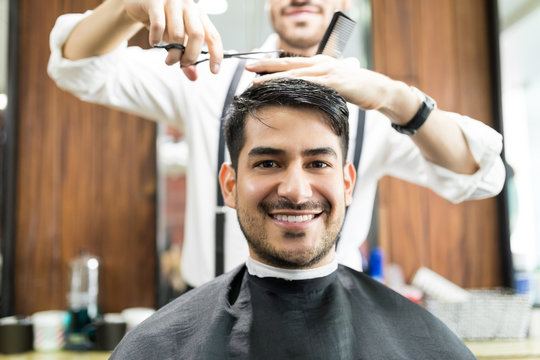 Client Smiling While Getting Hair Service From Hairdresser