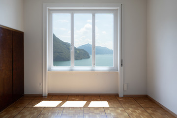 White room with lake view window
