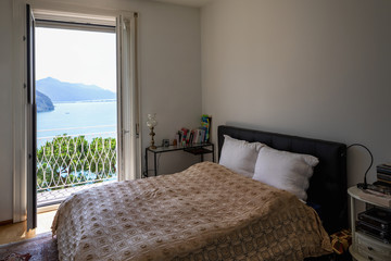 Bedroom with lake view on a summer day