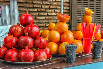 Fresh fruits of pomegranate and orange for making juice....