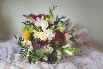 Gorgeous bridal bouquet with garden roses, carnations, freesias and greenery