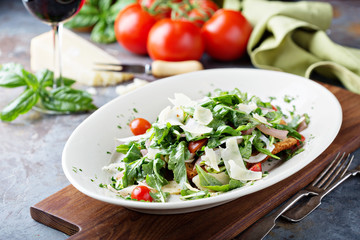 Chicken parmesan topped with arugula