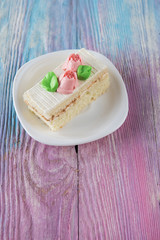 Tasty mini cake on a color gradient background