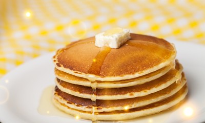 Stack of Small pancakes in syrup