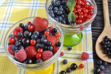 berries of red-blue color close-up in a glass vase
