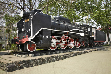 Steam locomotive near railway station in Yuzhno-Sakhalinsk. Sakhalin island. Russia