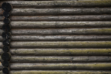 Old wooden wall made of timber decorated with ropes