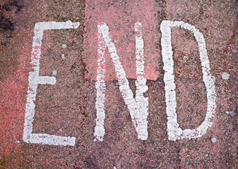 End sign on red floor