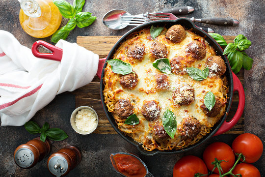 Baked meatballs with spaghetti and cheese